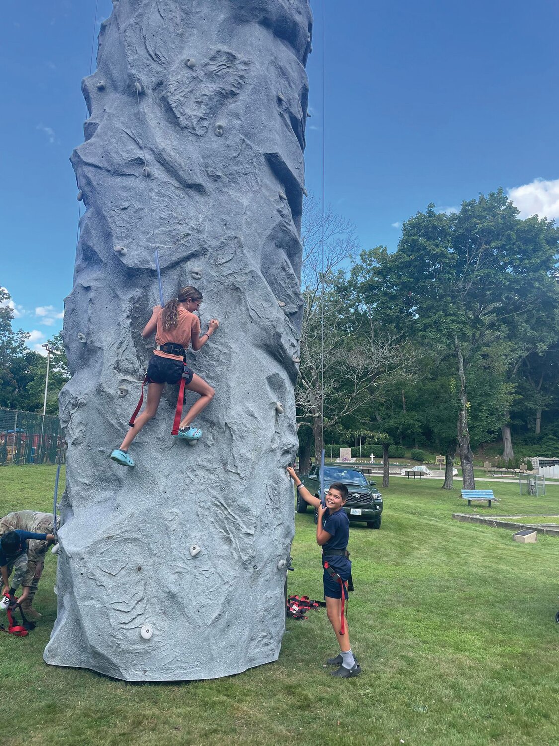 STEEP CLIMB: Victoria Andreozzi and Anthony Vieira weren’t afraid to tackle the climbing wall provided by the Rhode Island National Guard.